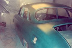 In paint booth applying green tinted sealer