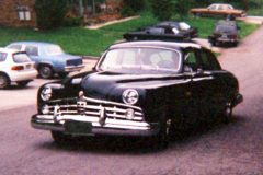 The paint is a high in pearl later year Lincoln Forest Green. So the car tend to look black at some angles, purple in other and green in sunlight