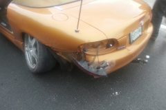 Car slid into a high curb and broke the rear spindle and crushed rear quarter. Had to go to frame shop