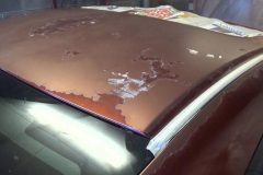Was brought in because top and various places on car were peeling and fading.