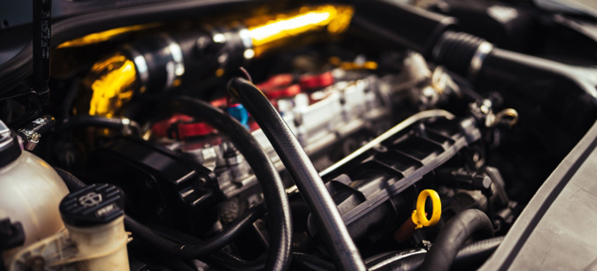 a man working on a project car